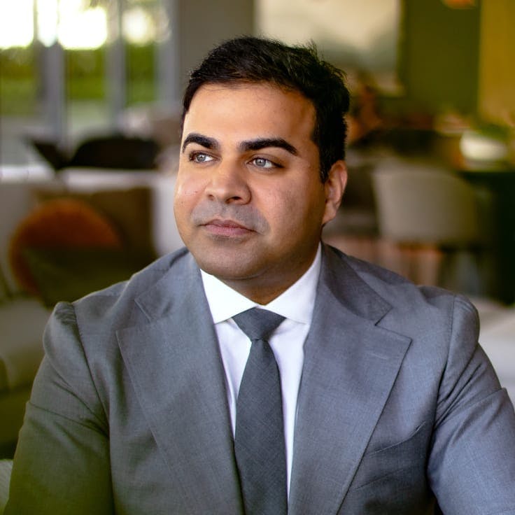 Close-up of Dr. Chopra in a suit