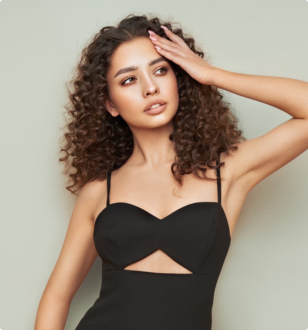 Woman looking to the side with a hand on her head