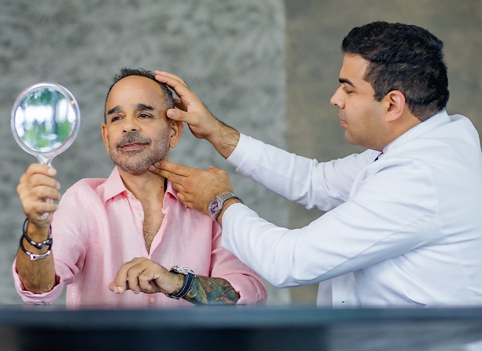 Dr. Chopra feeling patient's neck