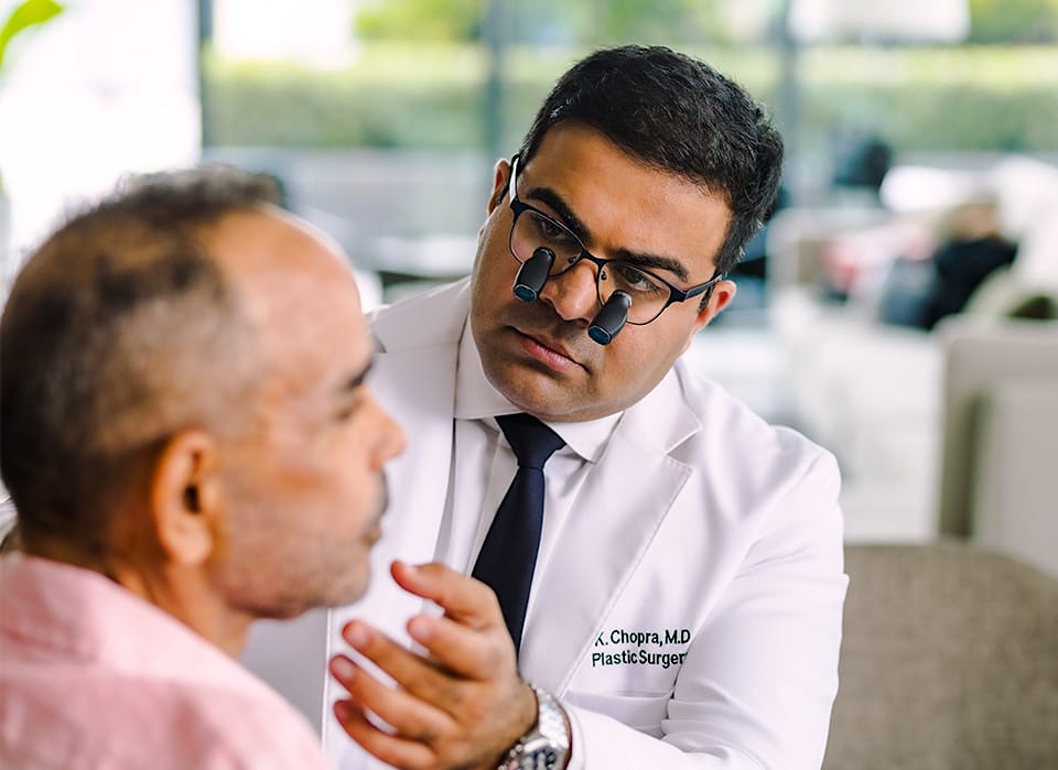 Dr. Chopra examining patient