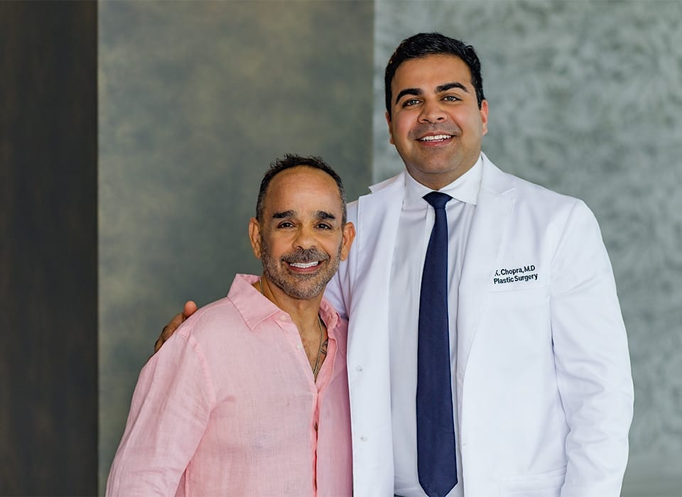 Dr. Chopra with patient standing together for picture