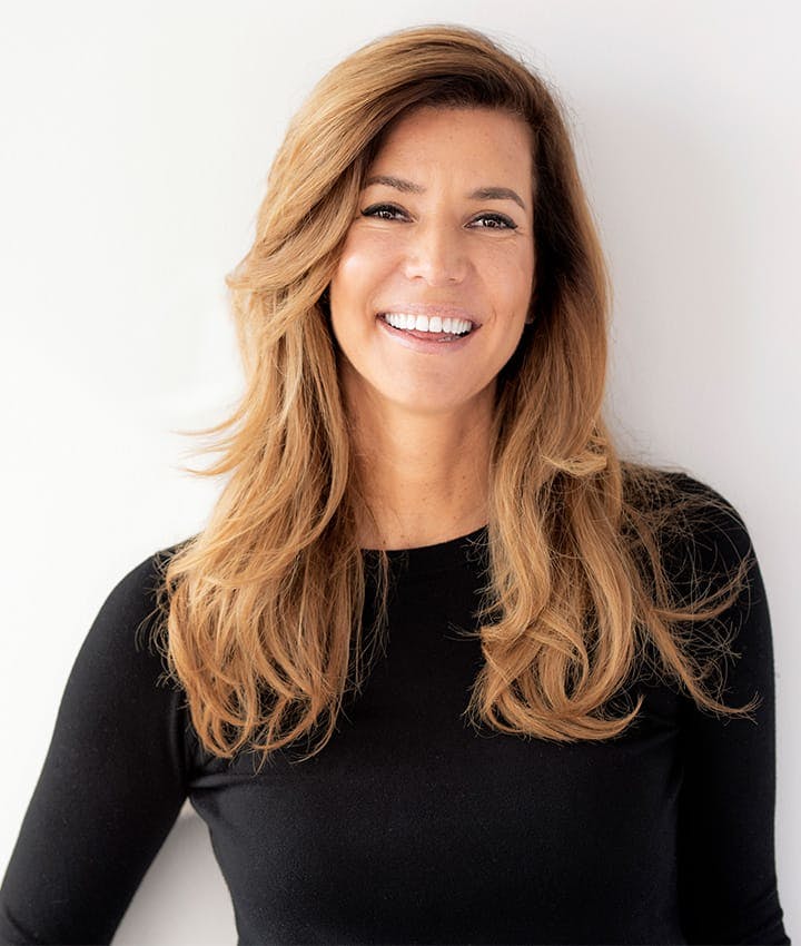 woman in black long sleeve smiling