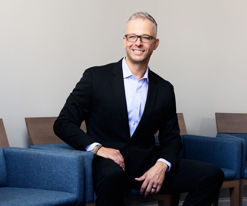 Dr. Guy sitting down