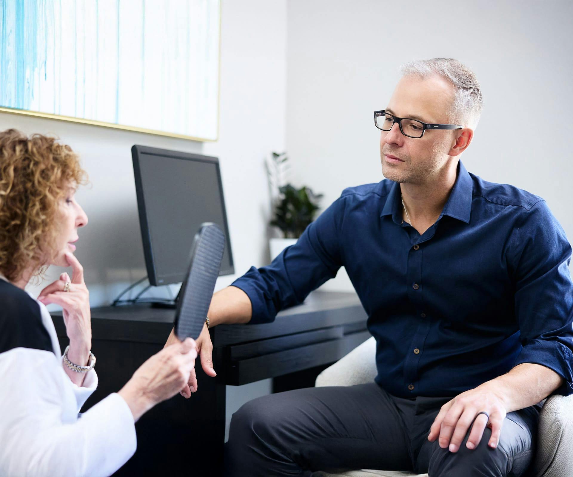 Dr. Guy speaking to patient