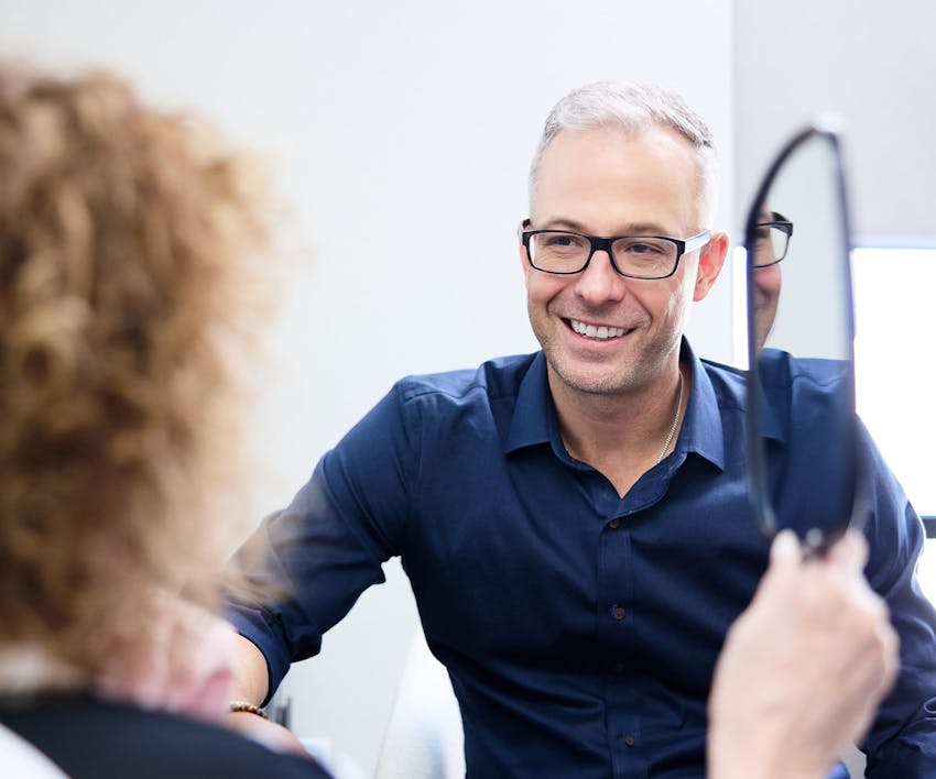 Dr. Guy smiling at patient