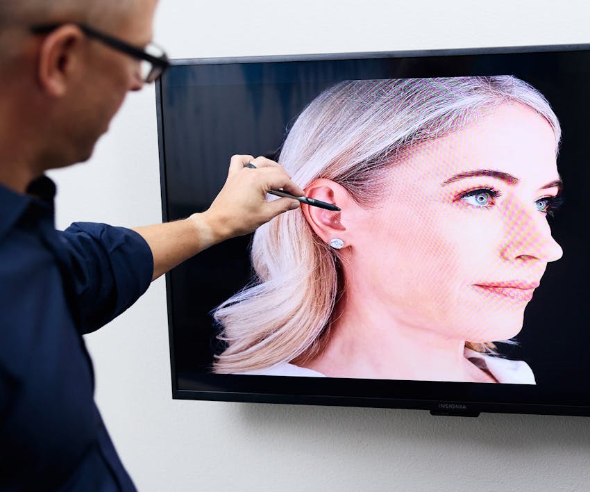 Dr. Guy looking at patient's 3D imaging on screen