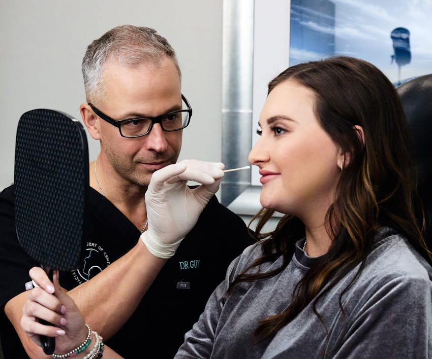 Dr. Guy looking at patient's face
