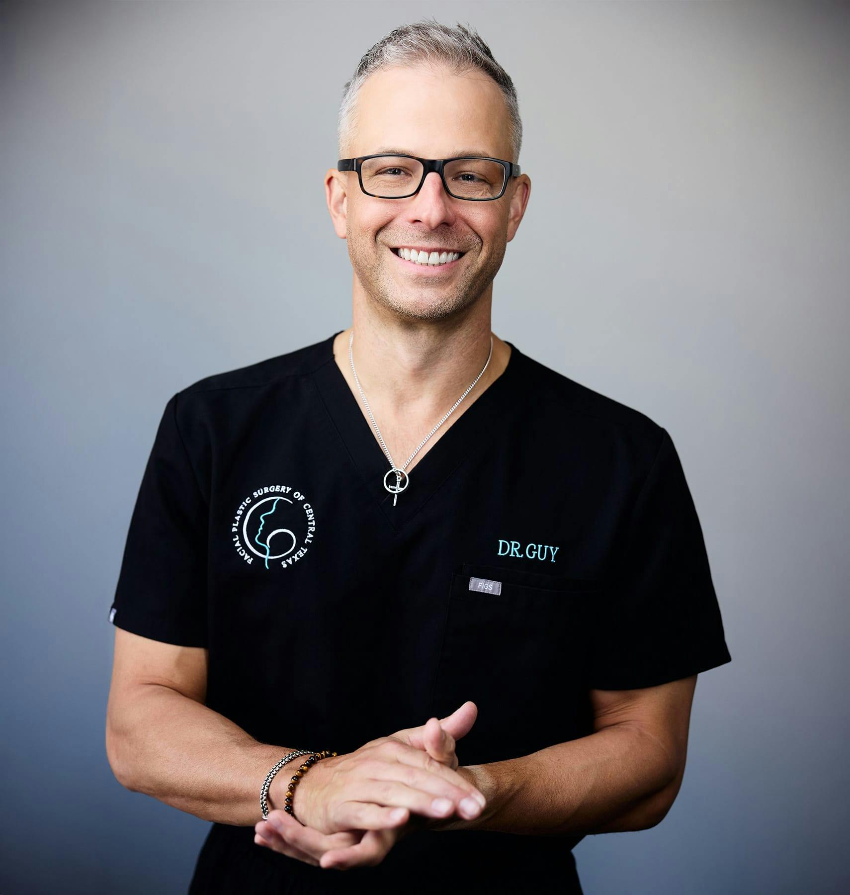 Dr. Guy with hands together