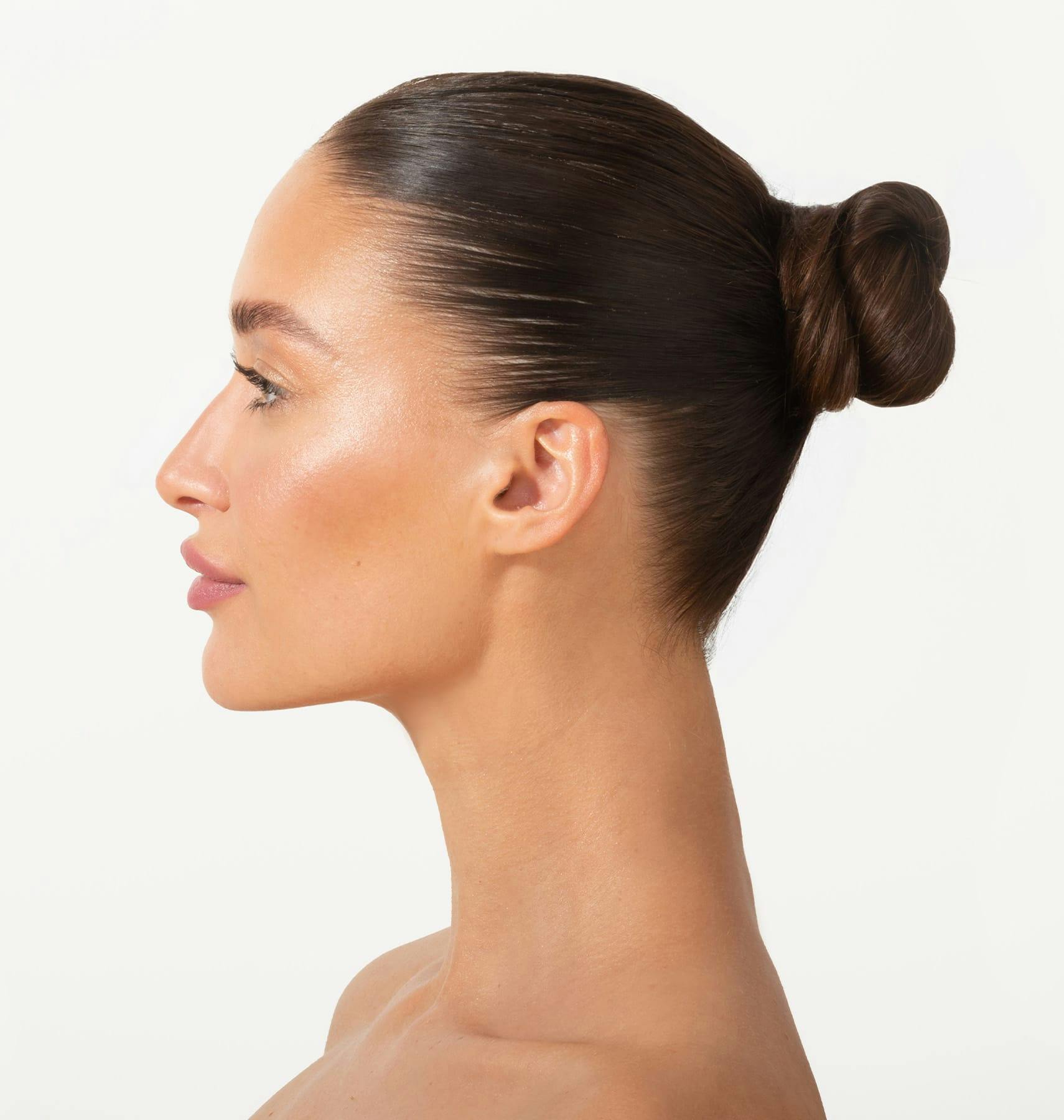 woman with bun side profile