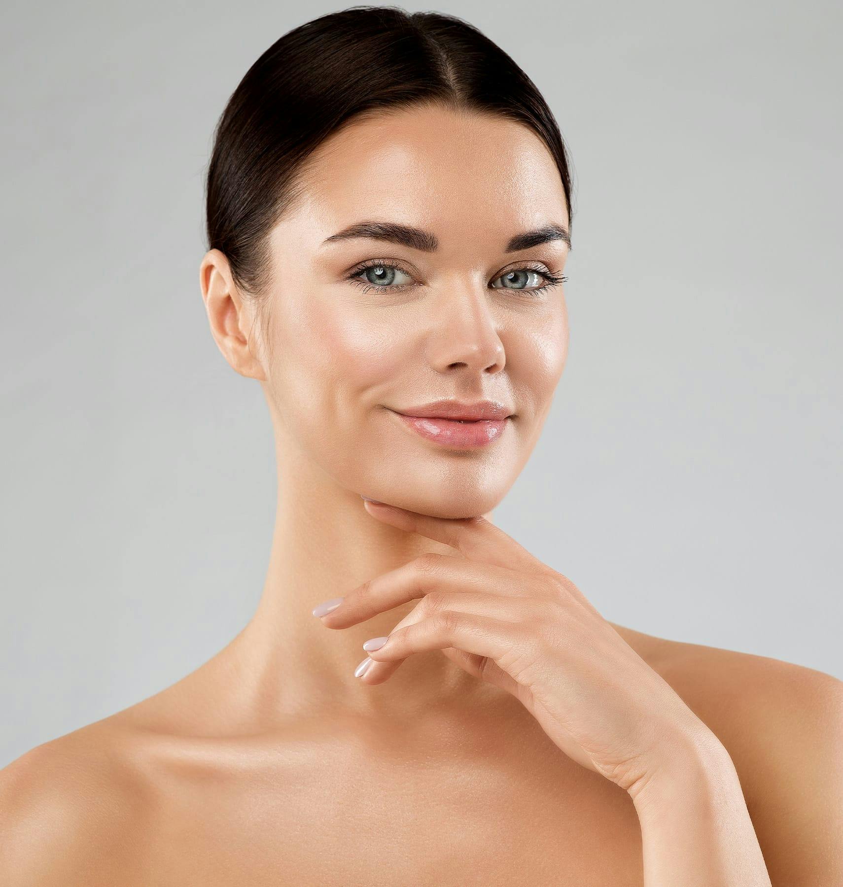 woman touching under her chin