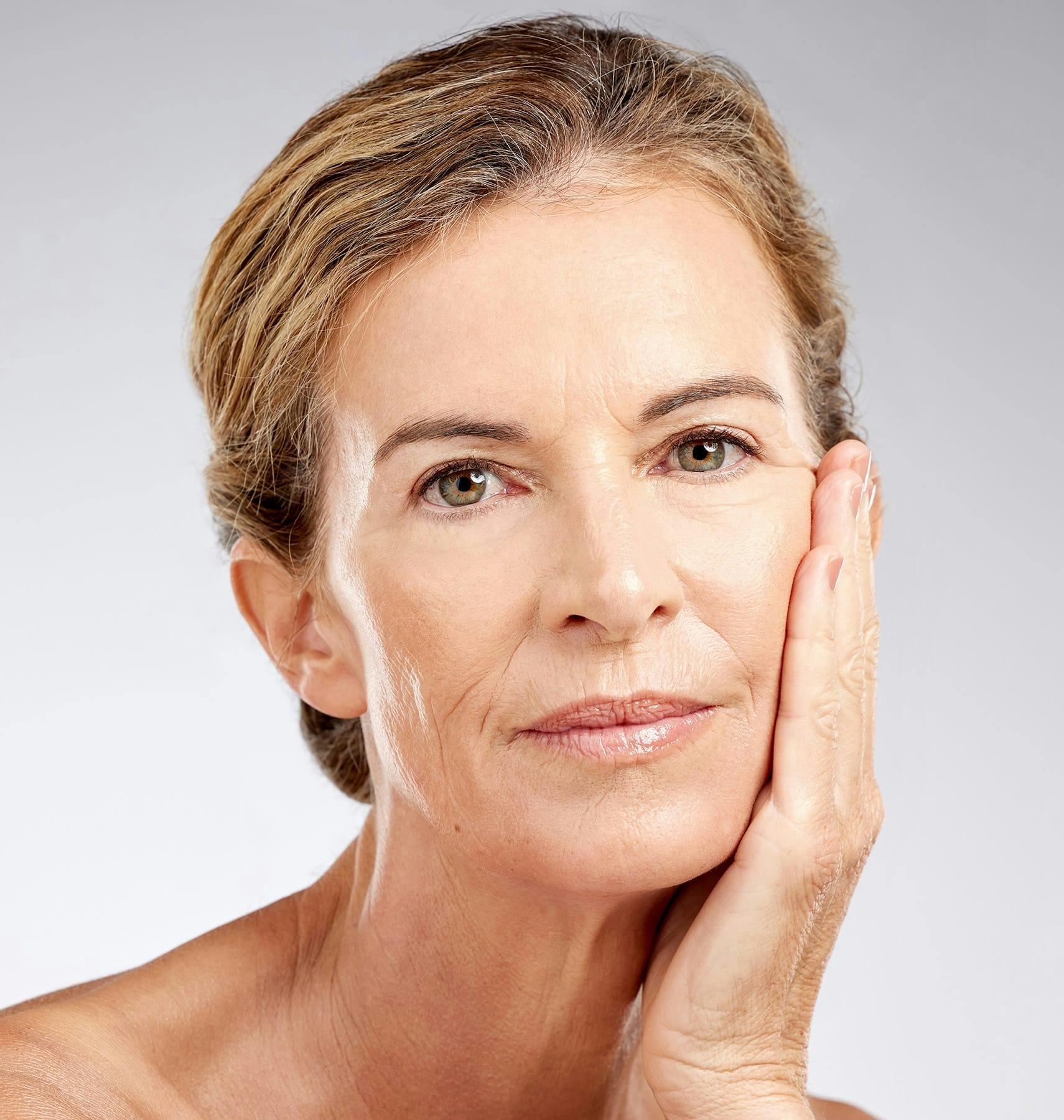woman leaning on the palm of her hand