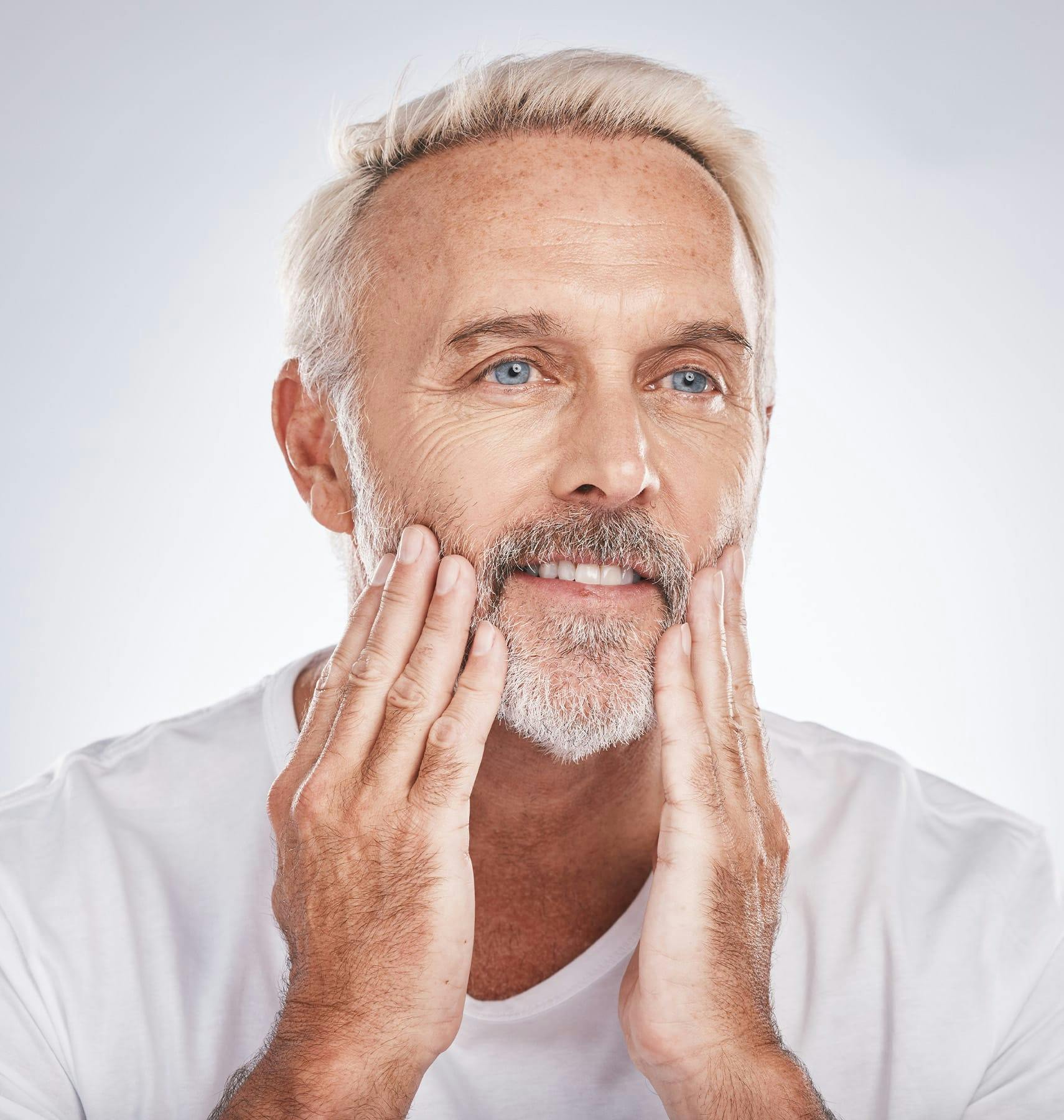 man touching his beard