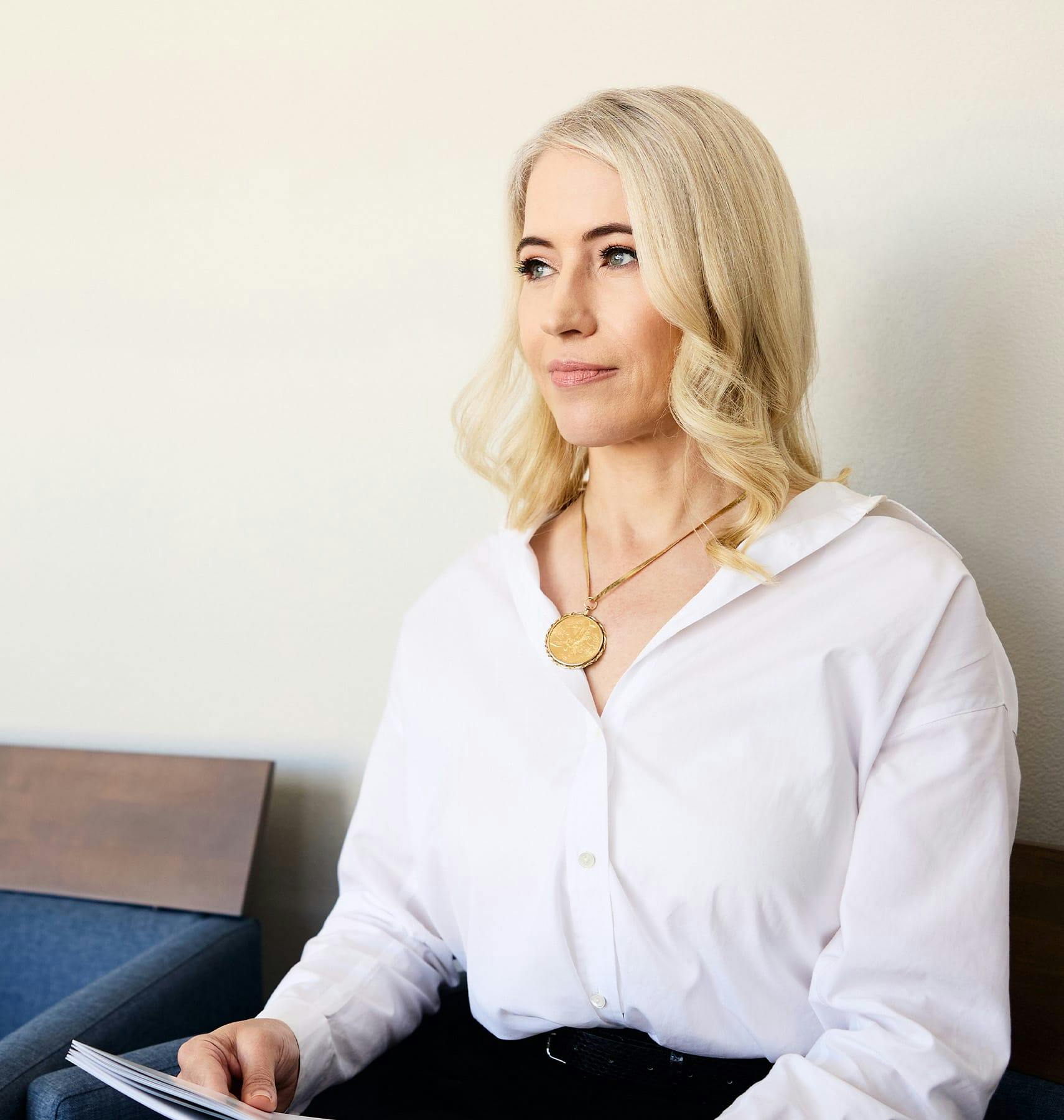 woman sitting in seat looking forward