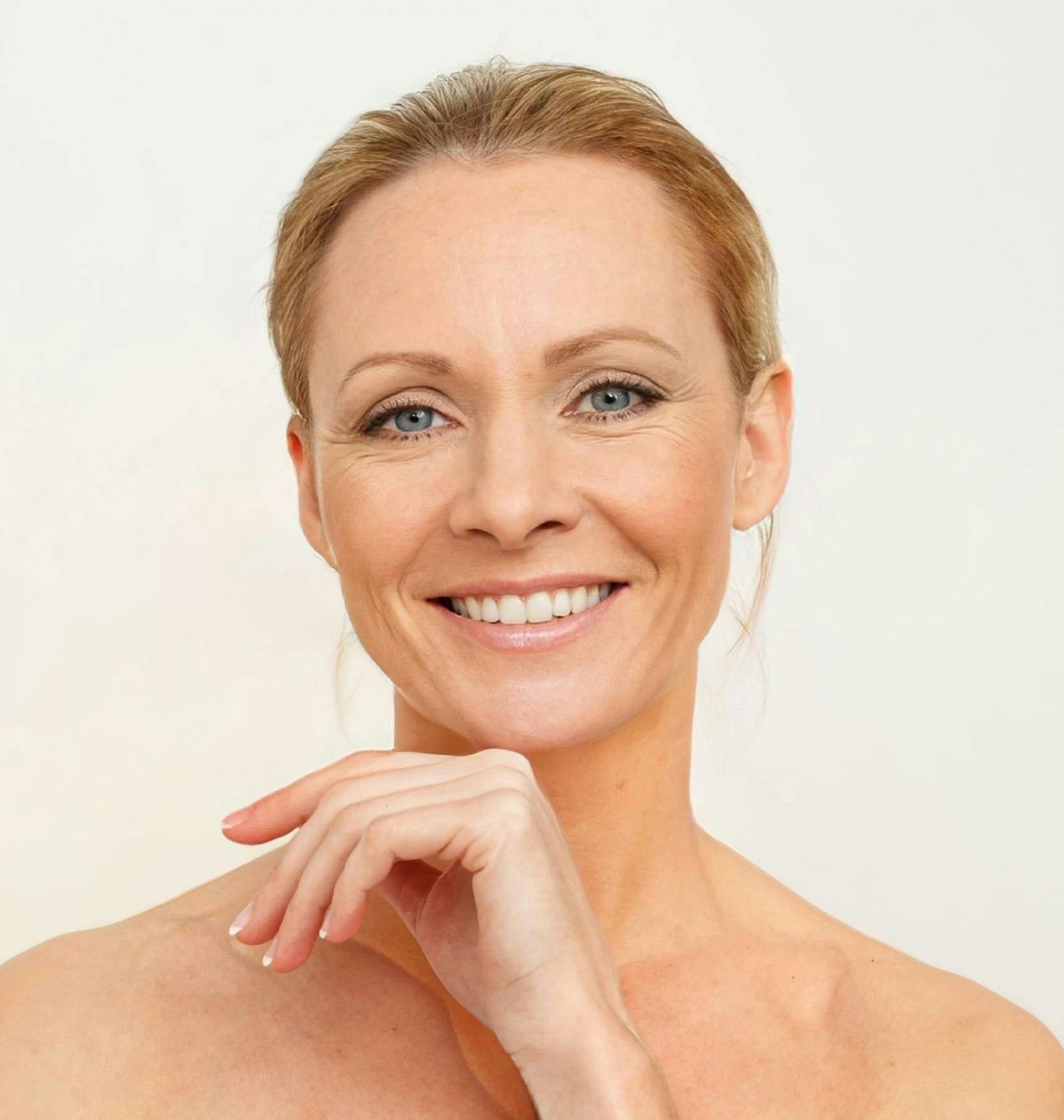 woman with hand near her chin