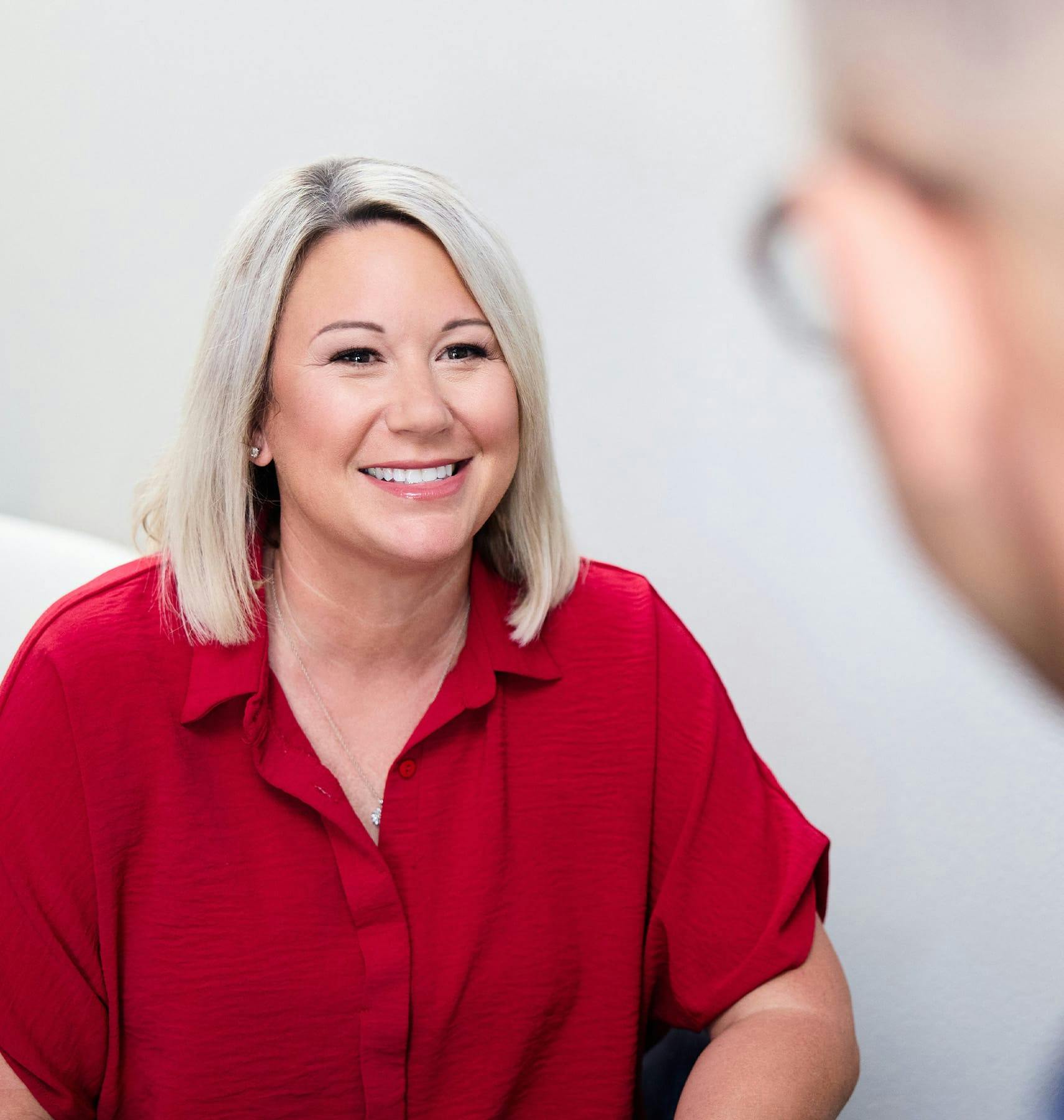 woman in red smiling