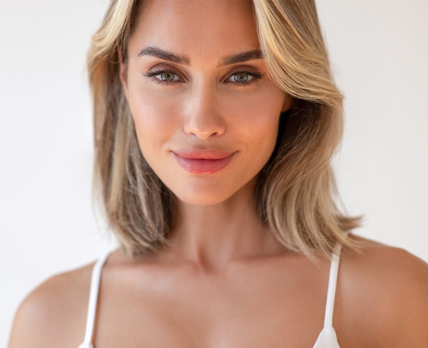 Smiling woman in white top