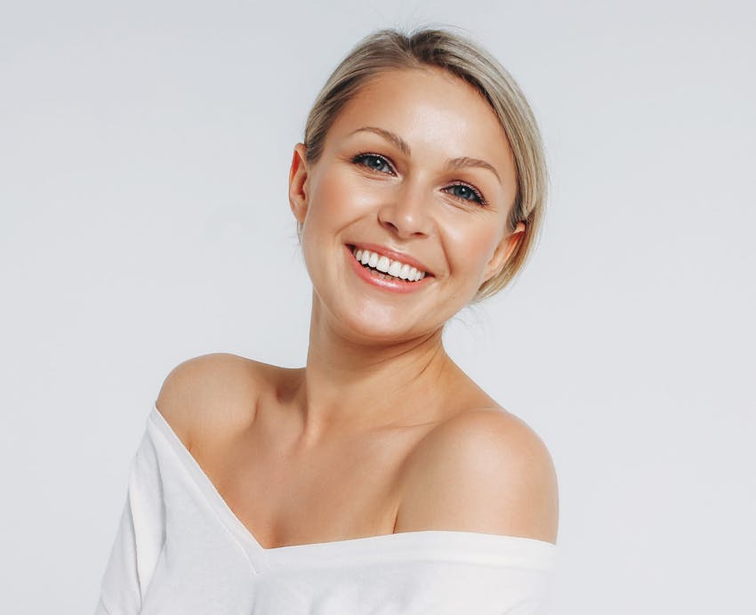 Smiling woman after successful nose job