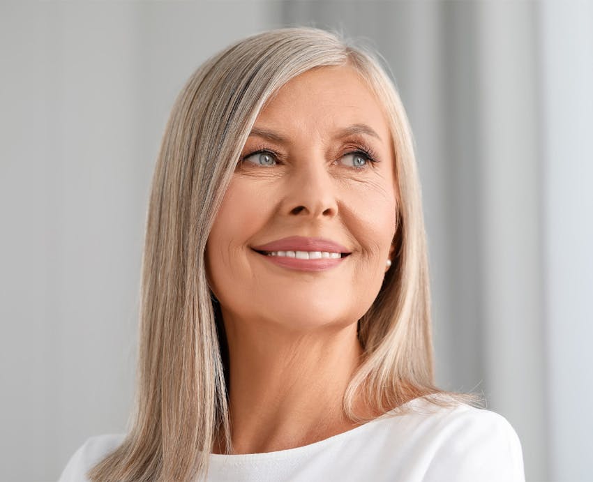 Woman smiling over shoulder