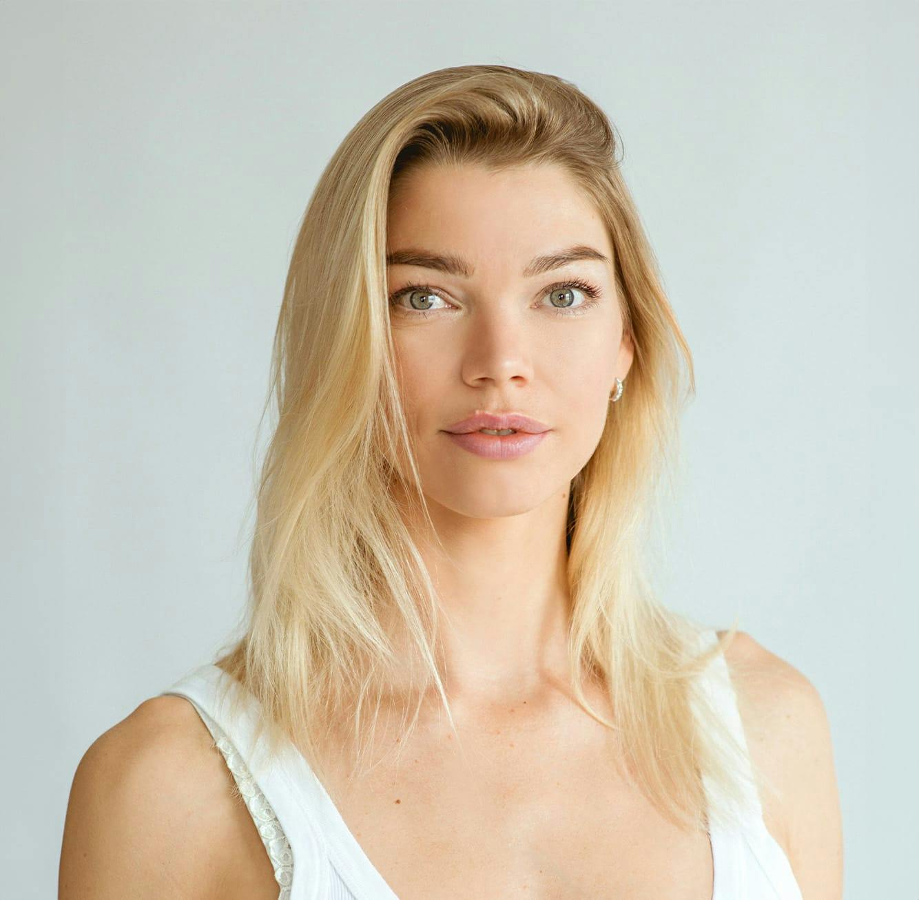 woman with blonde hair and green eyes