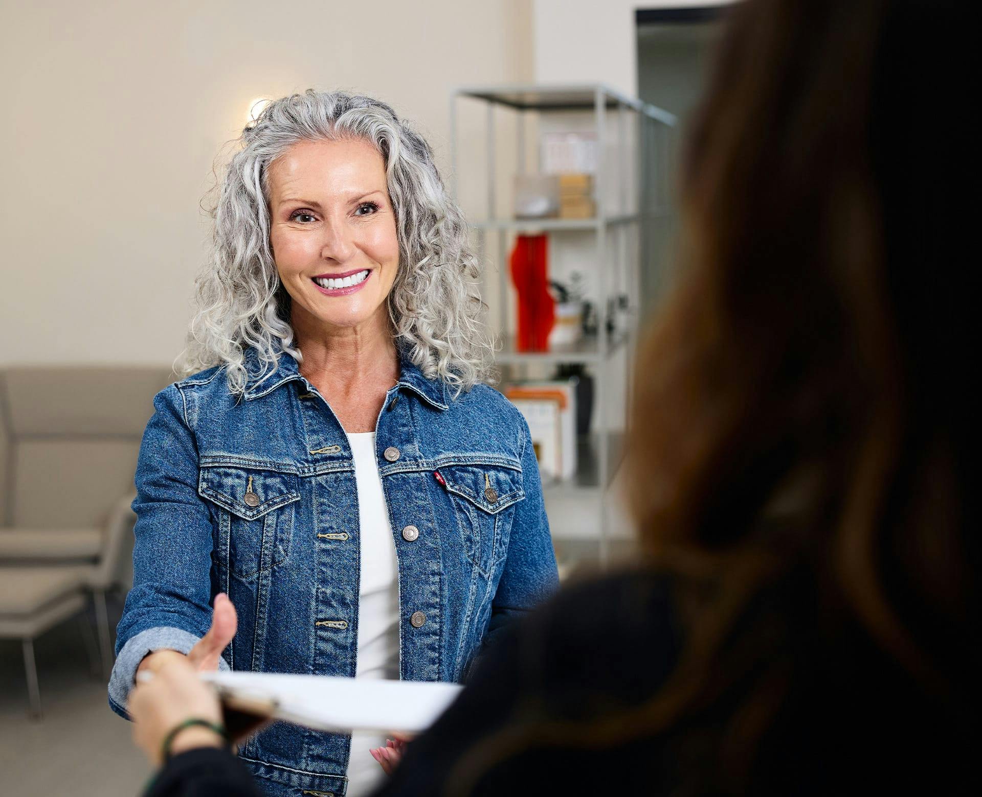 woman with grey curly hair
