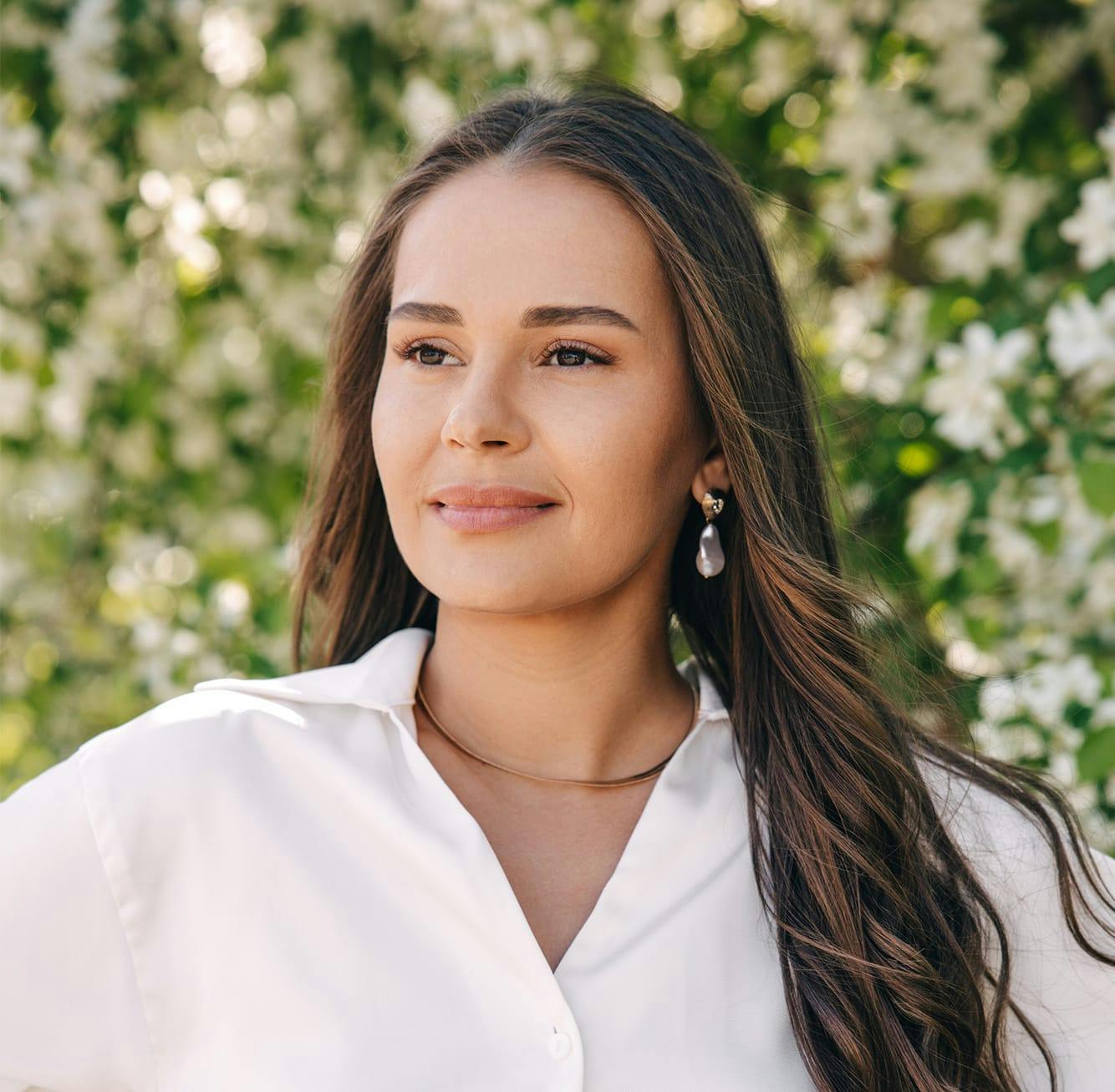 Smiling woman in white blouse