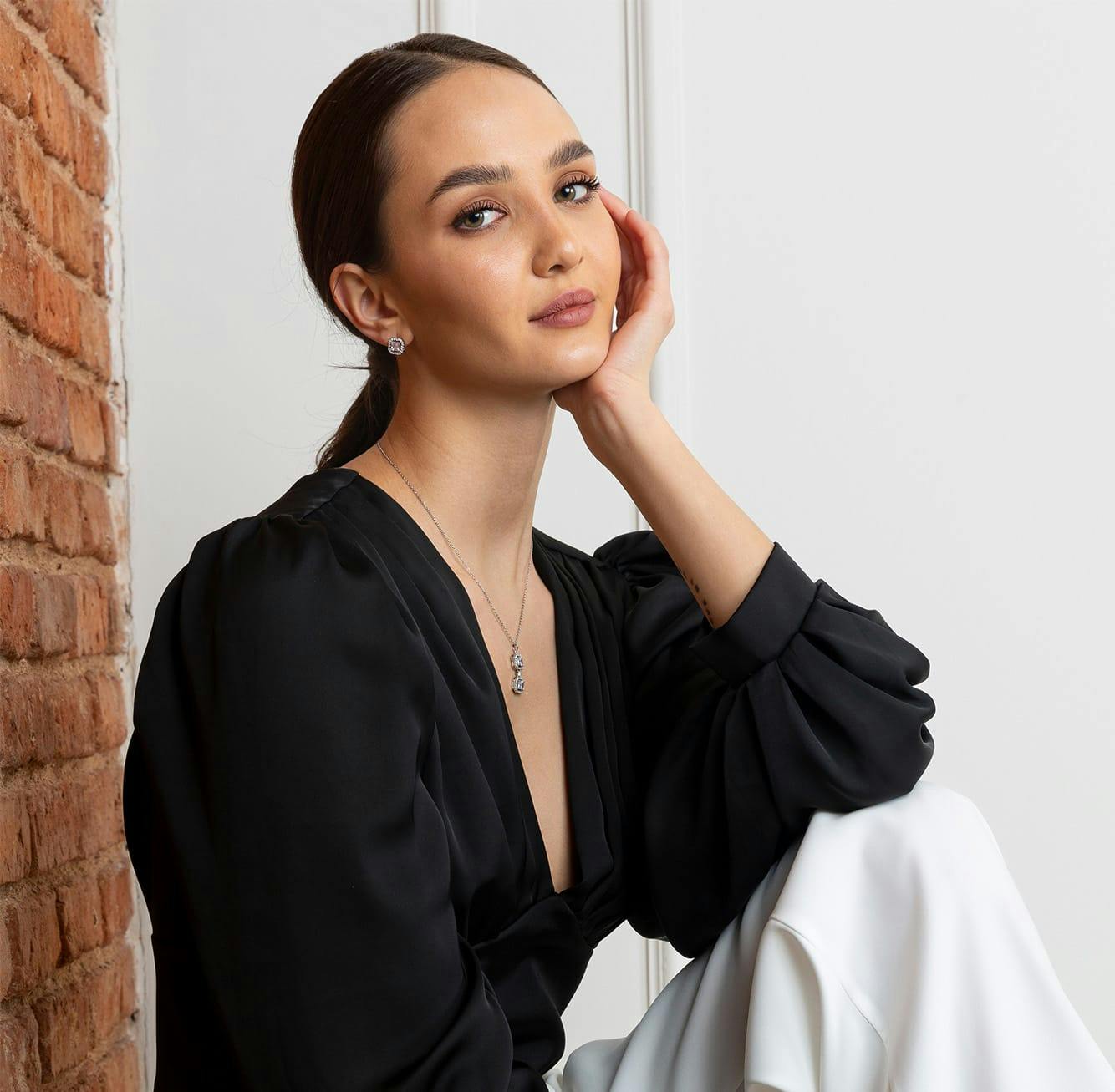 Woman posing in black blouse