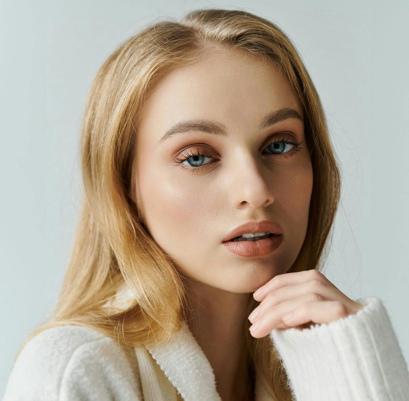 Woman resting her chin on her hand