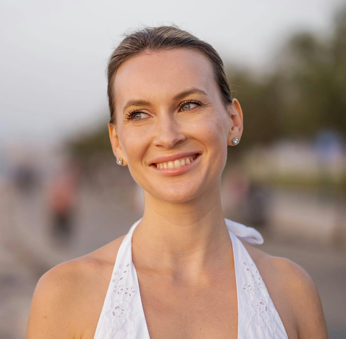 Smiling woman in white halter top
