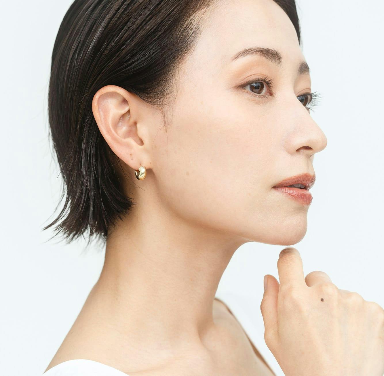 Woman toiching her chin