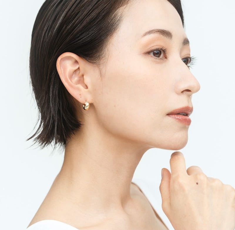 Woman toiching her chin