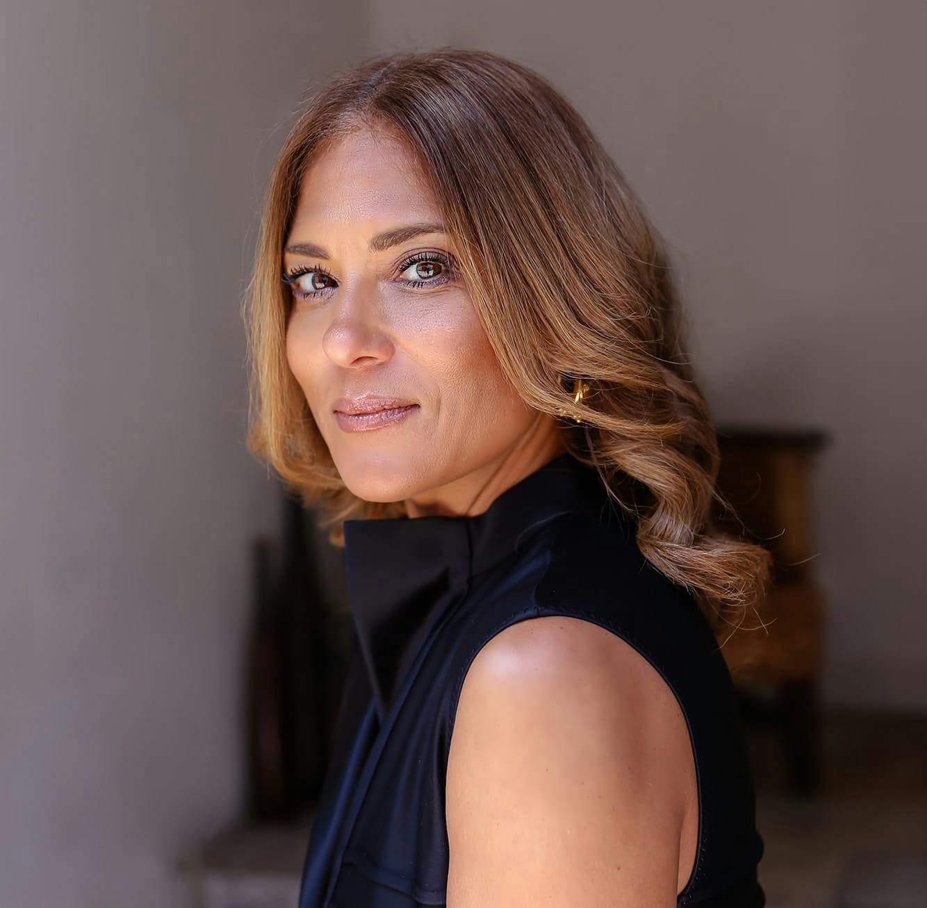 Woman smiling over her shoulder