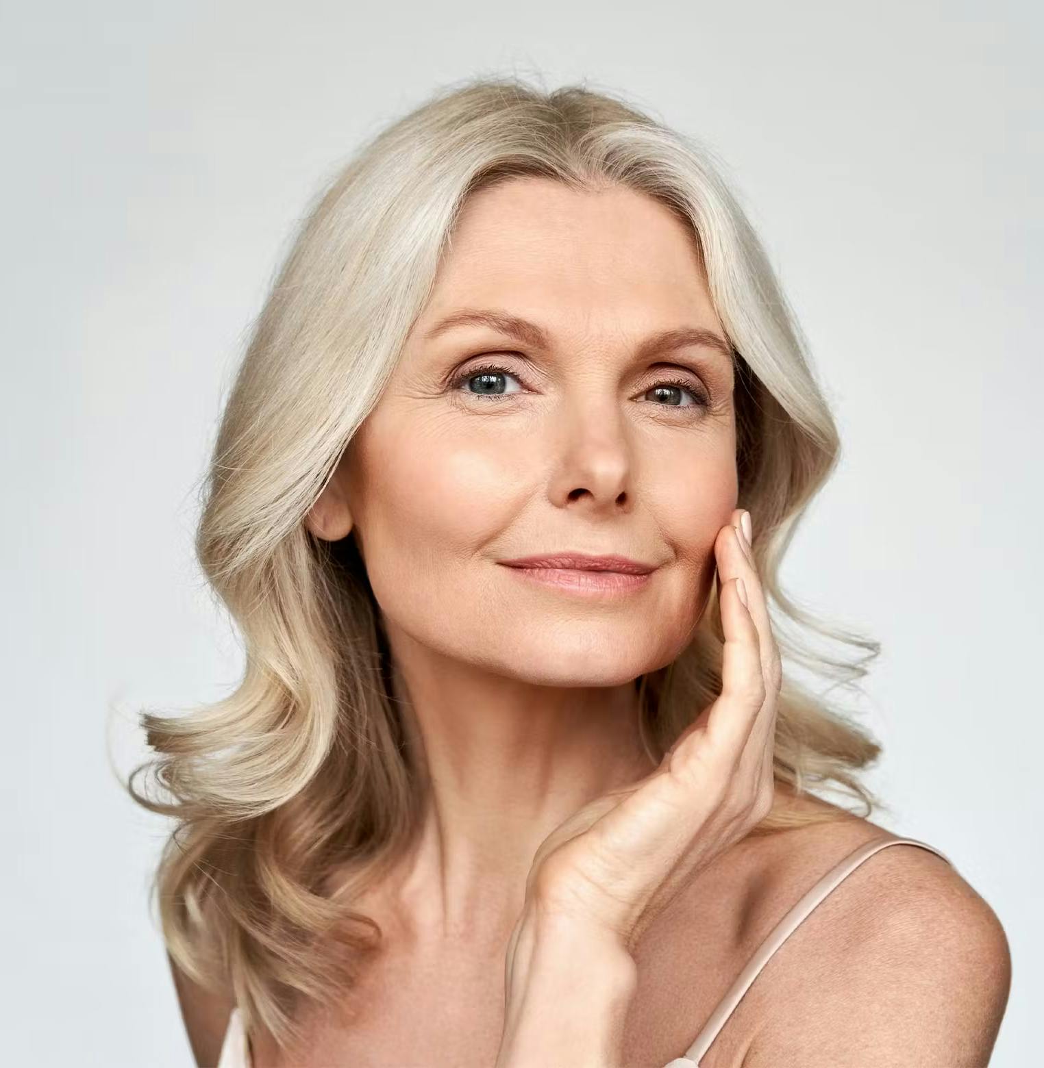 Woman with botox touching her face