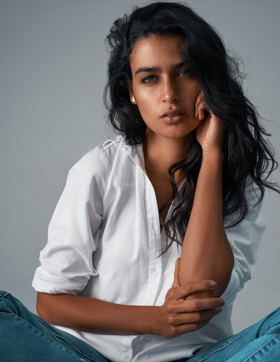 Beauitful woman poses in a studio shoot. Her smooth skin emulates the potential results of Botox in Wellesley