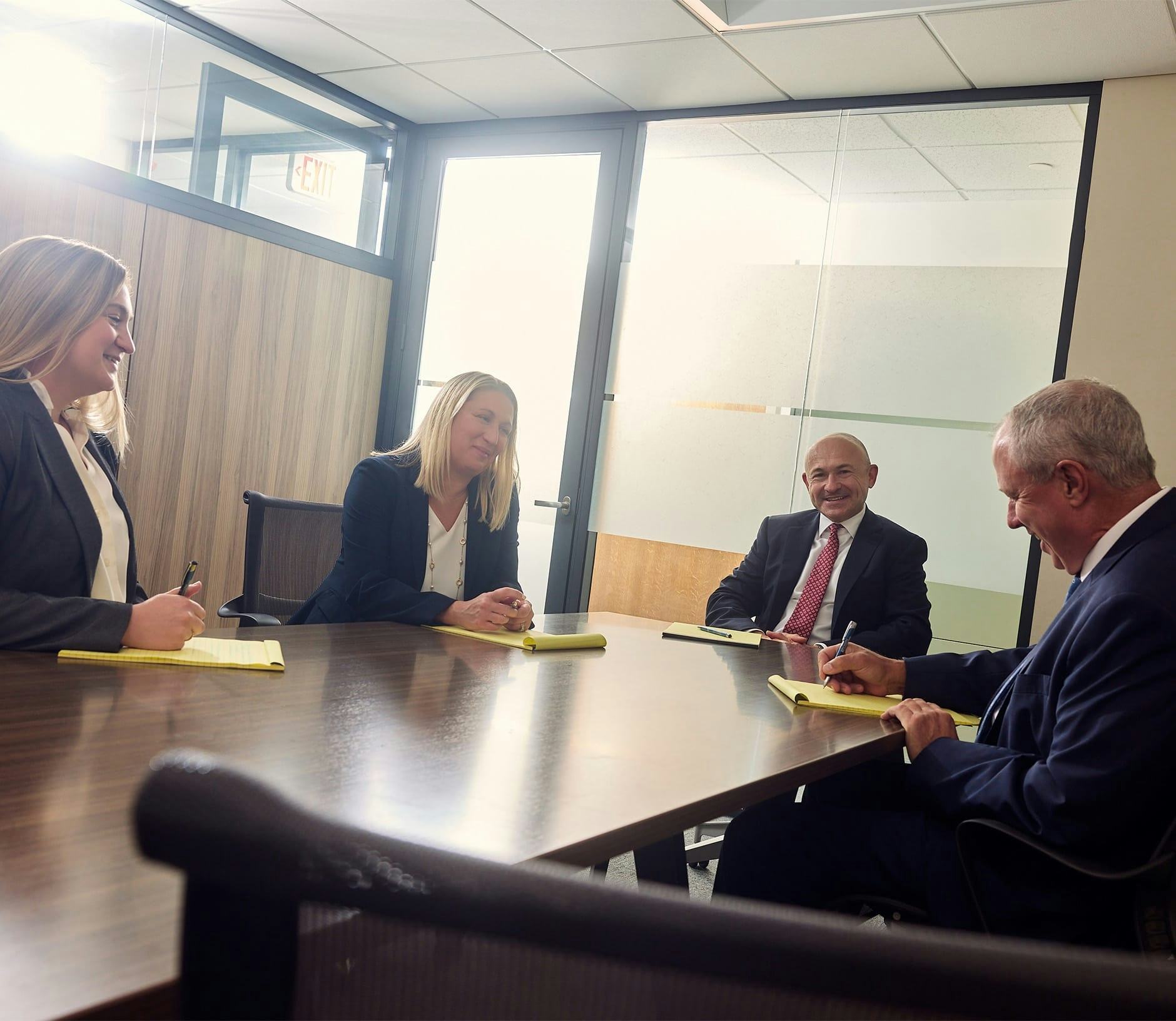 attorneys sitting with eachother at table