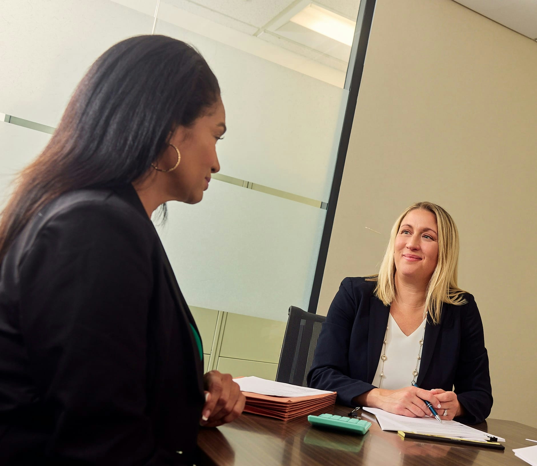 attorney speaking to her clients