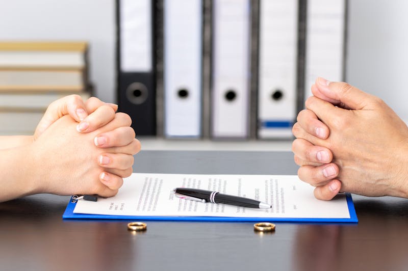 People with their hands on a document