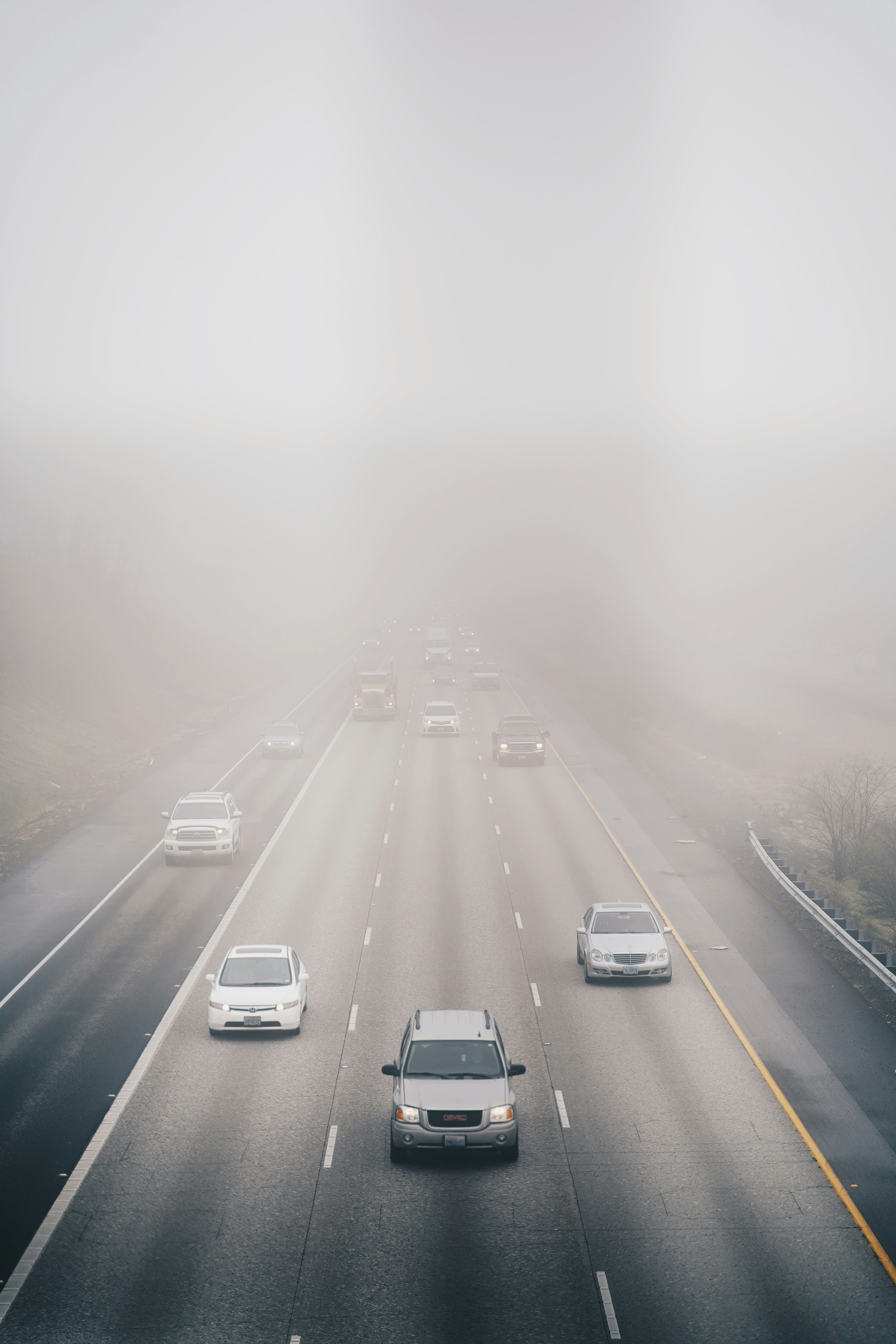 Cars driving on a motorway in the fog
