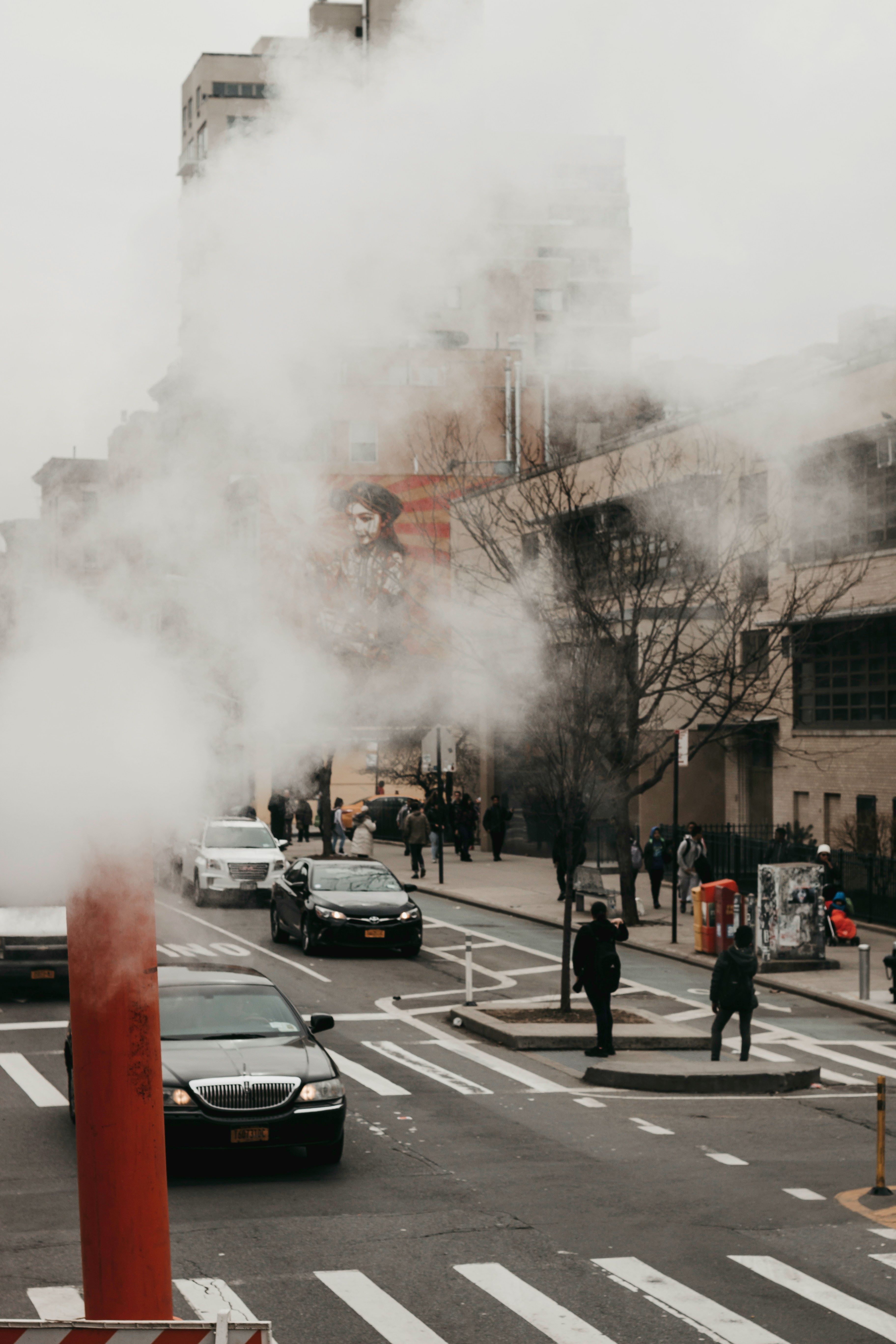Car traffic in a city, fog in the foreground