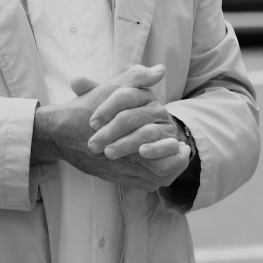 greyscale of someone's palms touching together
