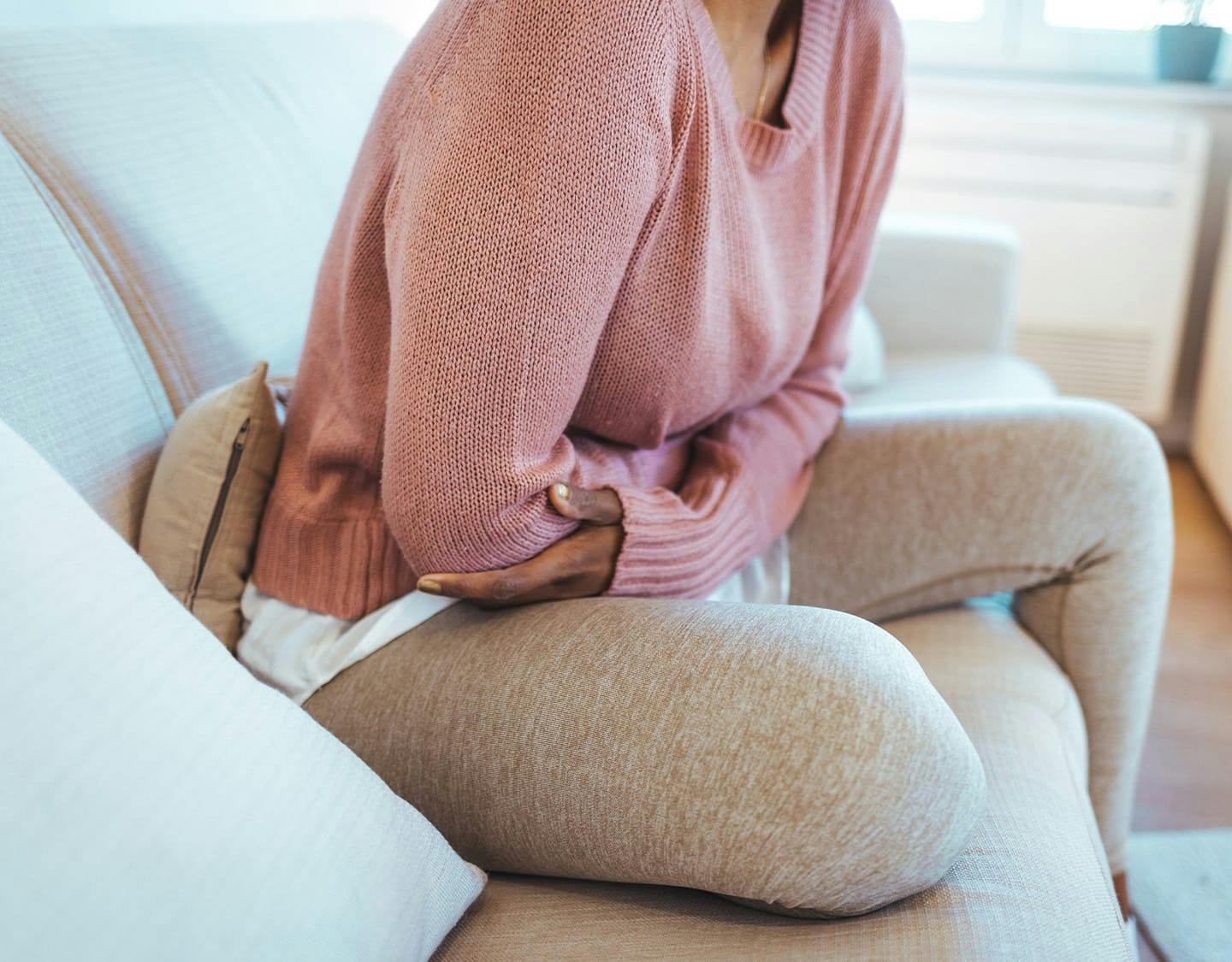 woman cluching her stomach