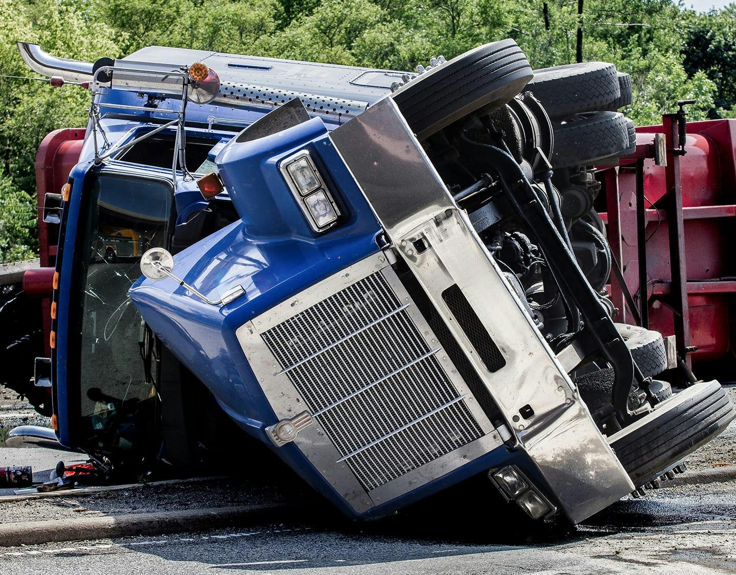 semi truck on its side
