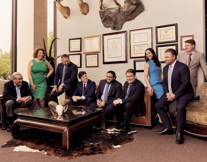 group of attorneys sitting on a couch