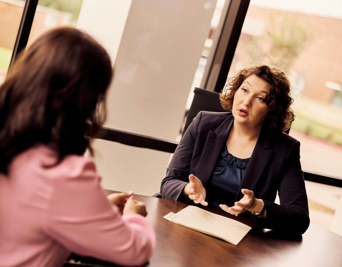 attorney talking to woman