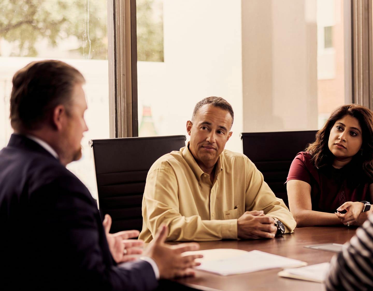 4 people talking around a table