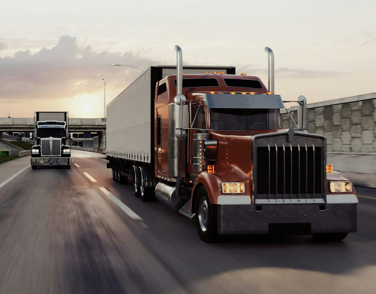 two 18 wheelers driving