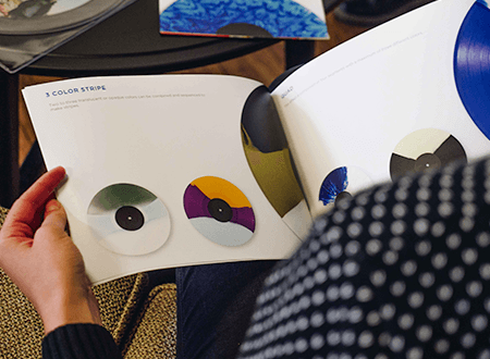 A vinyl effect brochure being read