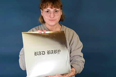 PRPGeminiLoop.gif Becca holding Negative Gemini Bad Baby record jacket