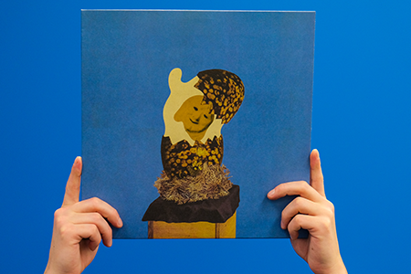 Hands holding Corridor – Junior vinyl record