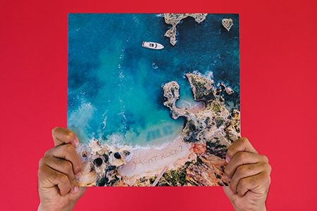 Hands holding The Alchemist - Yacht Rock 2 vinyl record