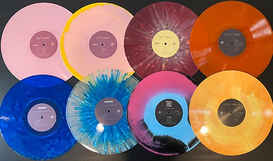 Multiple colorful vinyl records